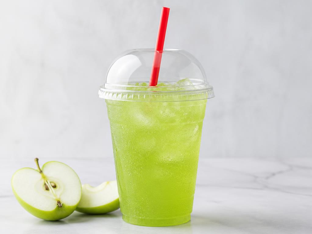Green Apple Lemonade in a clear cup with a red straw