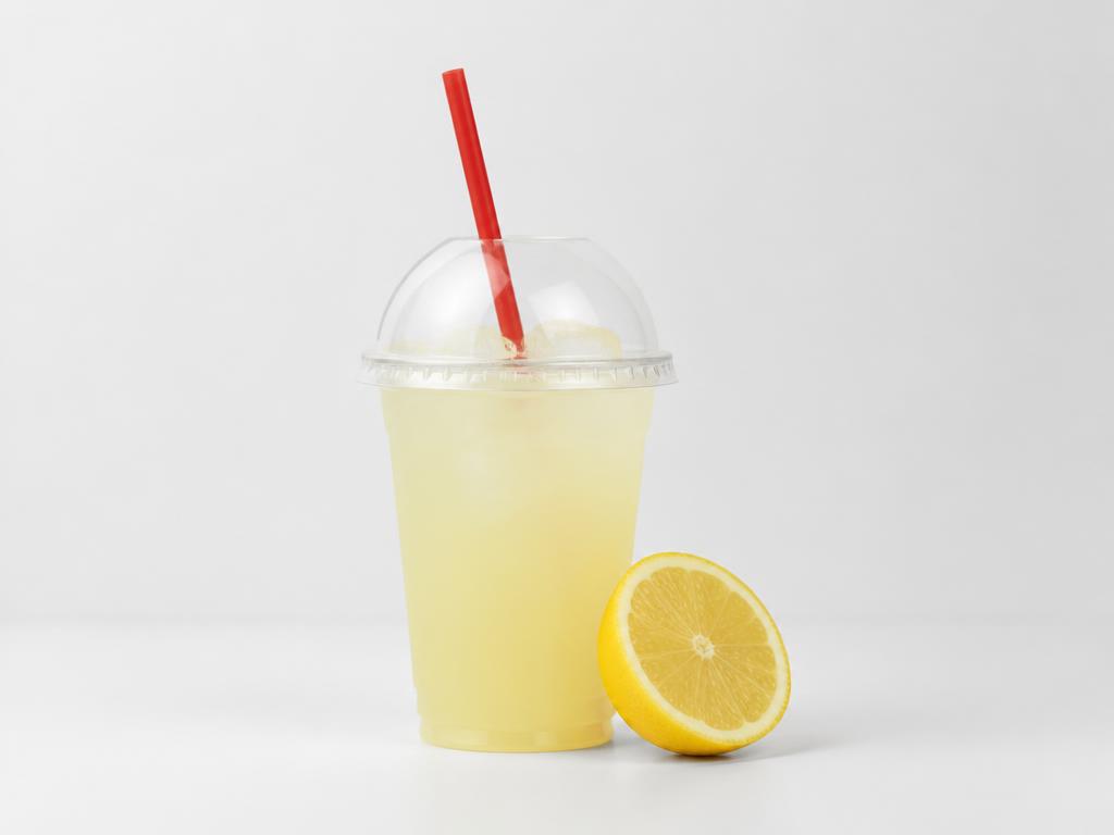 Plain Lemonade in a clear cup with a red straw